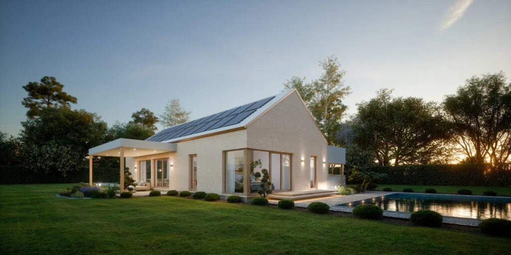 Außenansicht eines 
Kampa Hauses mit Photovoltaik Modulen auf dem Dach.